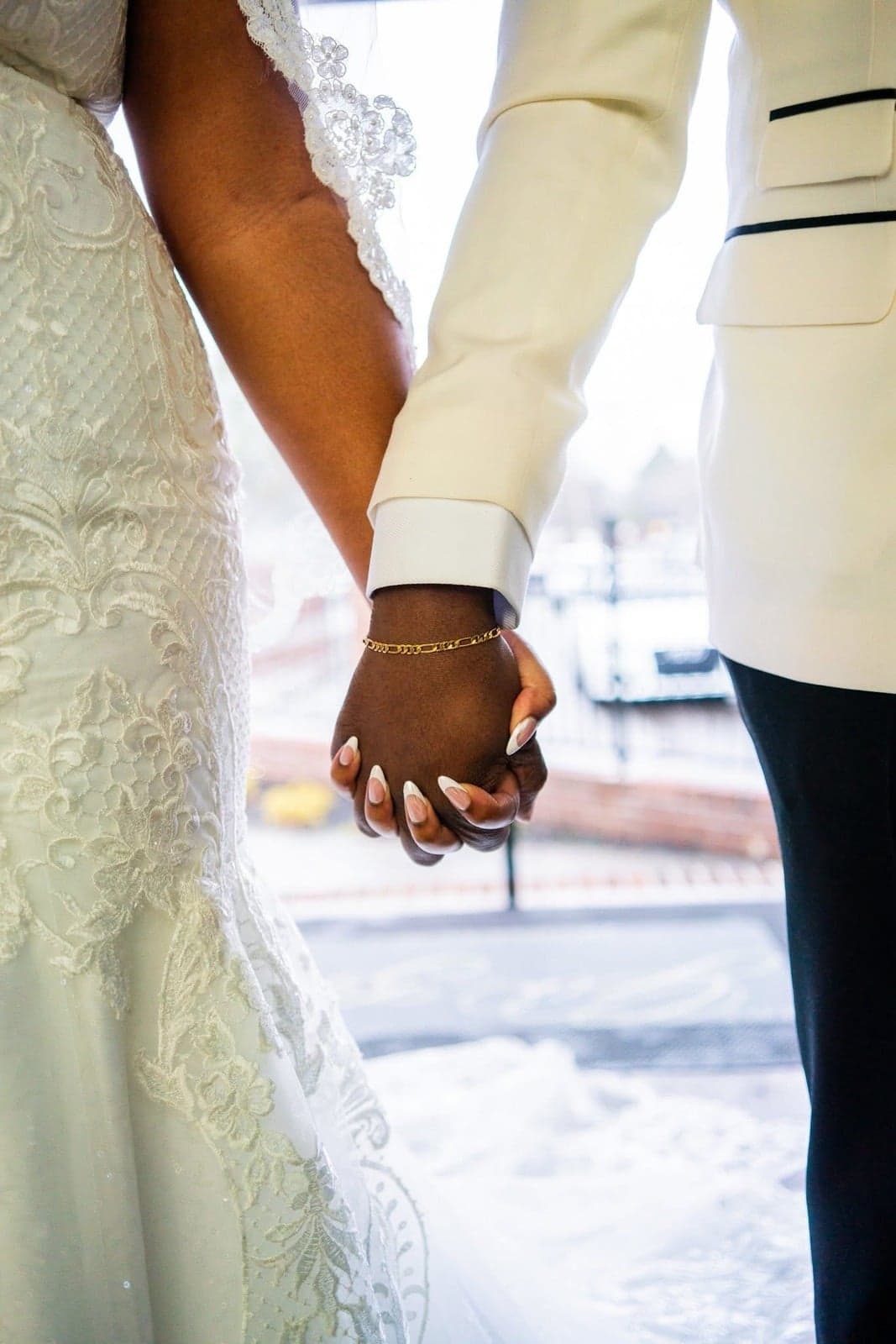 Bride and groom holding hands