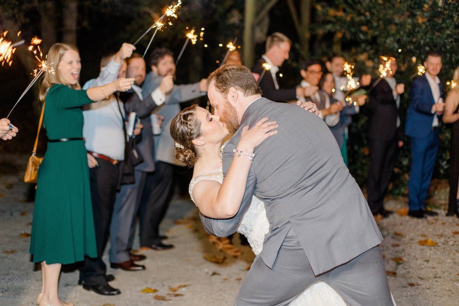 Sparkler send-off dip kiss